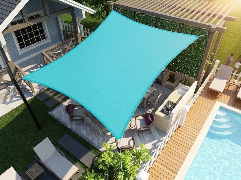 D-ring corner hardware tensioned on a curved-edge waterproof shade sail